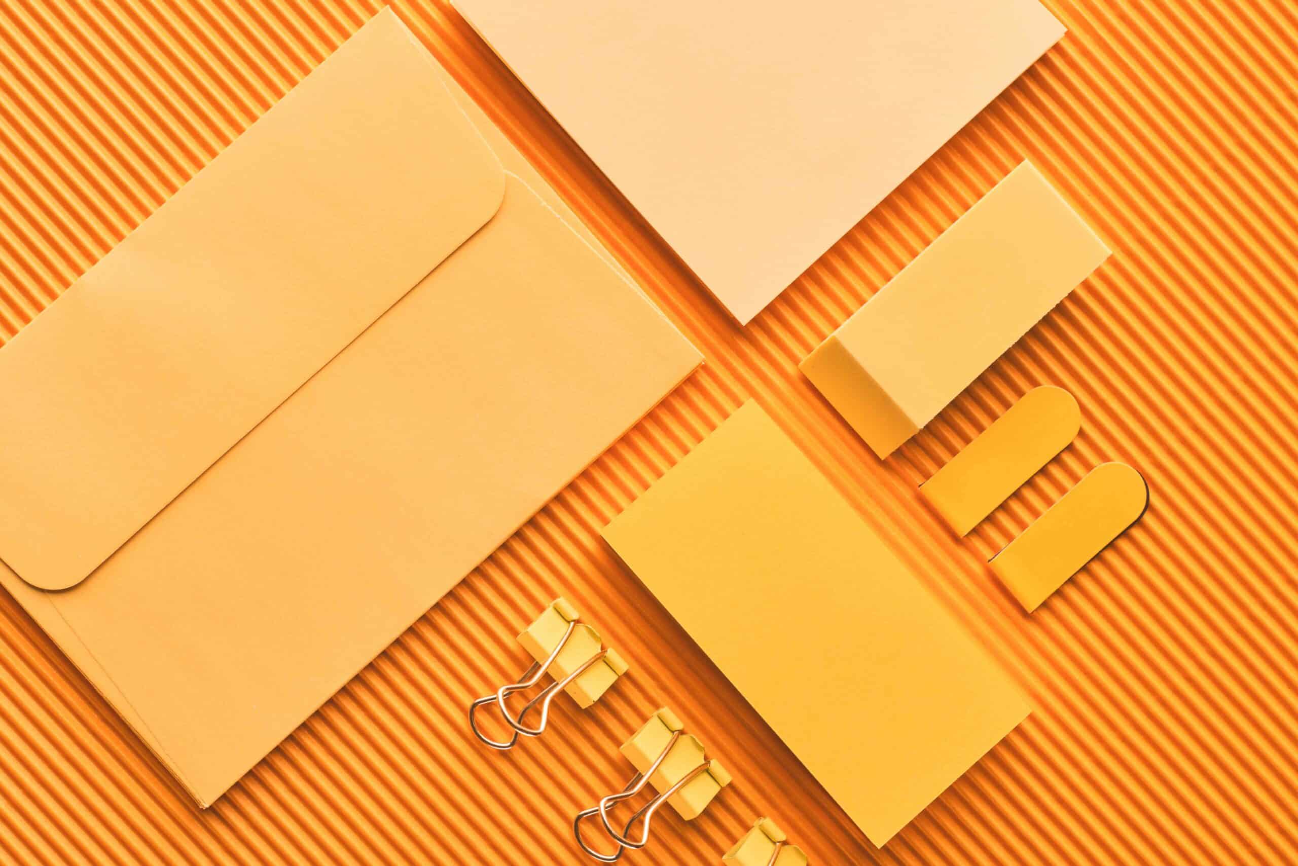 top view of arranged office stationery supplies on yellow