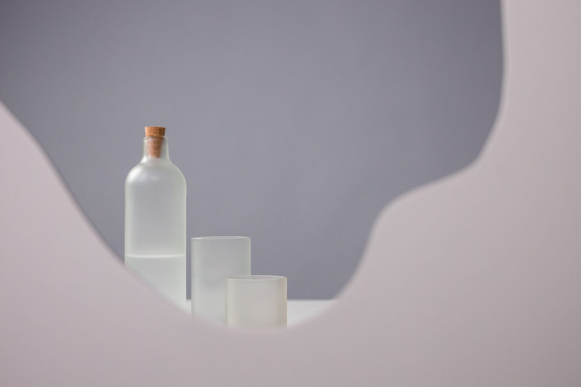 A set of bottles behind a wall
